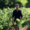 The organic Wine Maker Olivier Coste walking in organic vineyards in Languedoc France